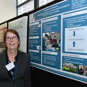Joanne Tallentire standing with research poster