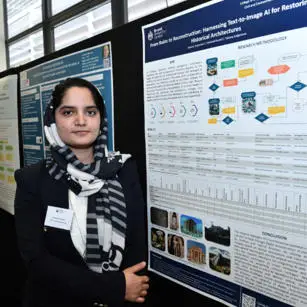 Kawsar Arzomand standing with research poster