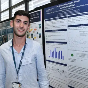 Matteo Vaccargiu standing with research poster