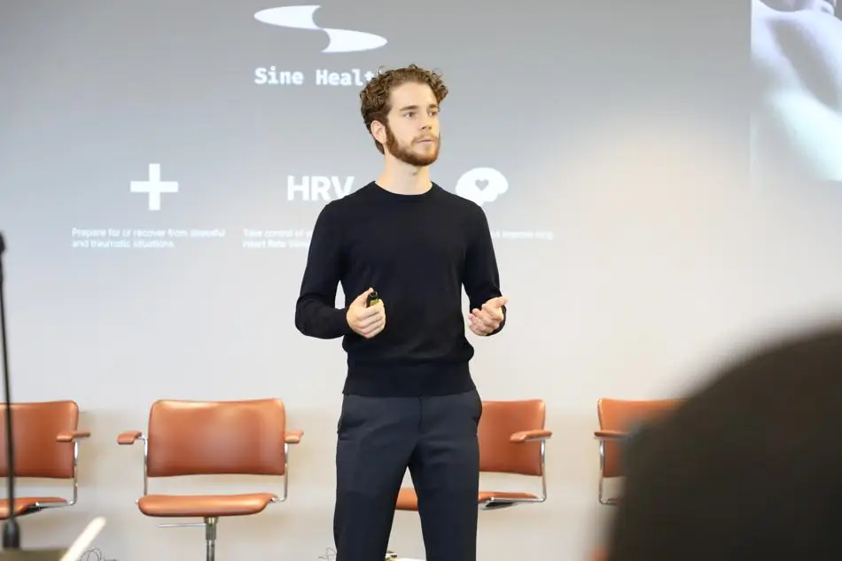 Graduate Louis DeCleyn pitching at the event 