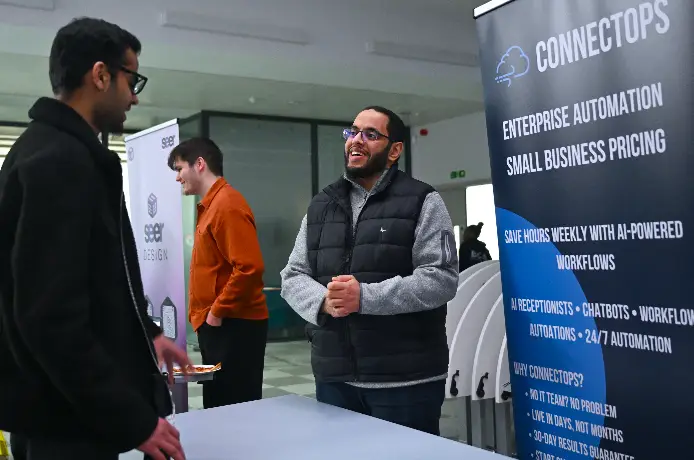 Students networking at Brunel Exhibition 