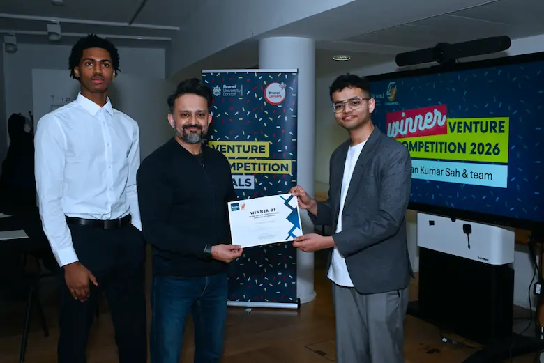 Kris Sah and team pictured with certificate, founder of Ruum
